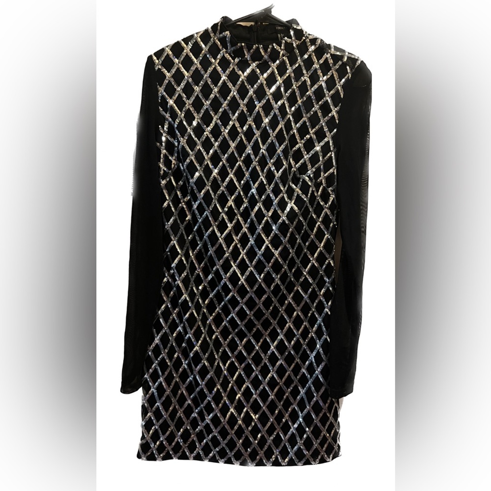 Black long sleeve mini dress with silver sequin design